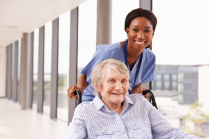 Nurse and a senior in a hosital lobby